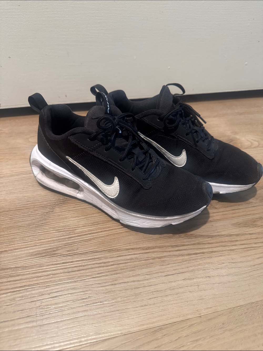 Nike Black and White Mesh Running Sneakers with Silver Swoosh